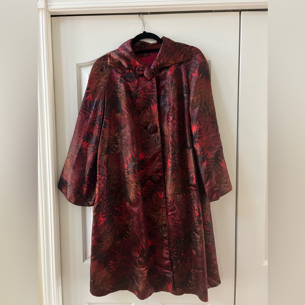 Vintage statement coat featuring a bold, multi-colored leaf print